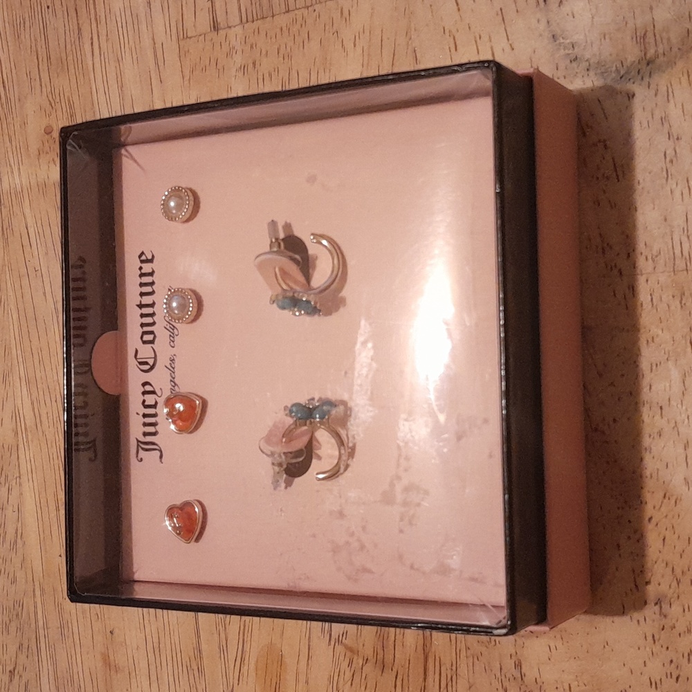 A set of three Juicy Couture earrings